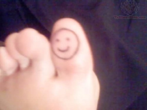 Smiley Tattoo On Bottom Of Toe